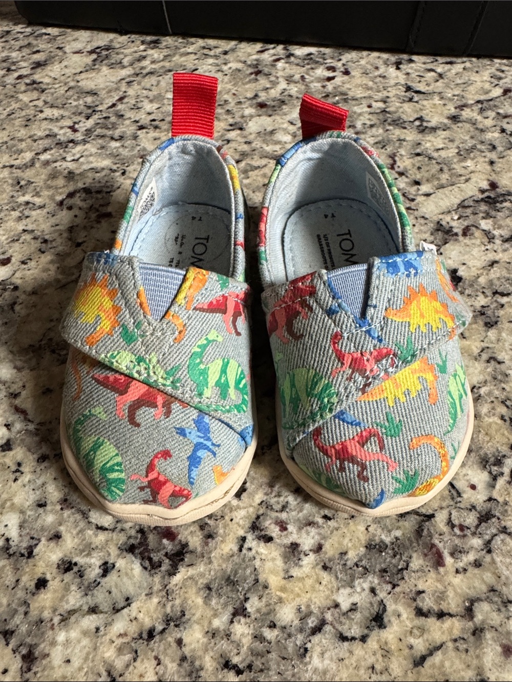 TOMS Baby Light Blue Slip-On Shoes with Multicolor Dino Print